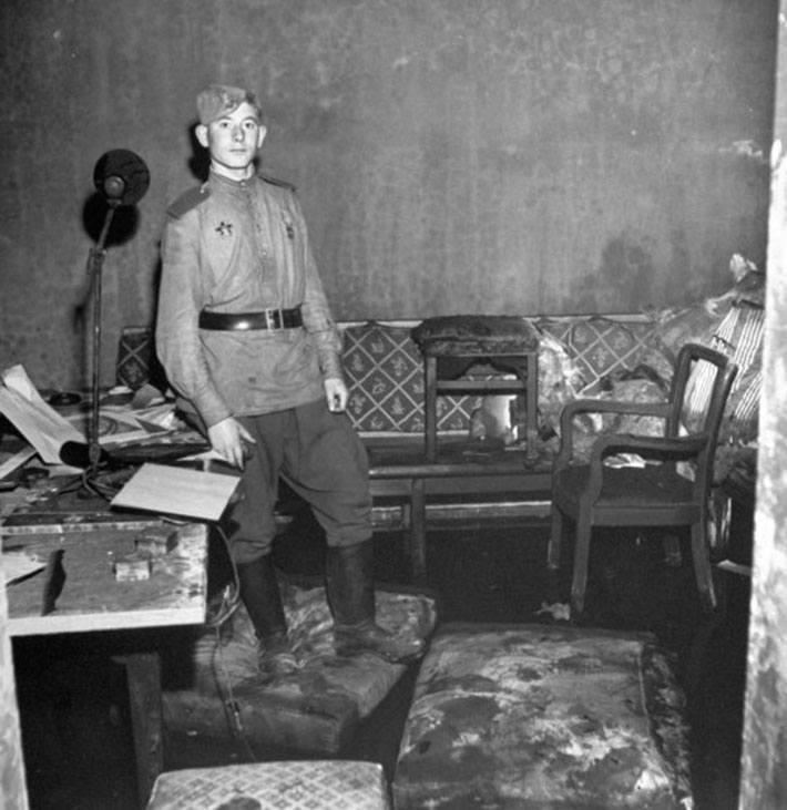 A Russian soldier stands in Adolf Hitler's bunker, Berlin, 1945.